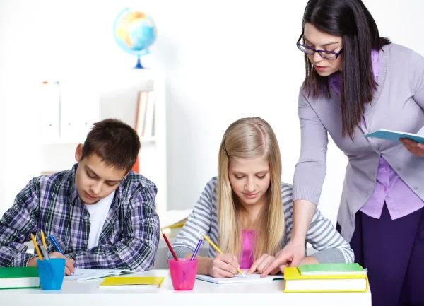 teacher-correcting-mistakes-pupil-s-notebook (1) (1)