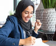 happy-businesswoman-taking-notes (1) (1) (1) (1)