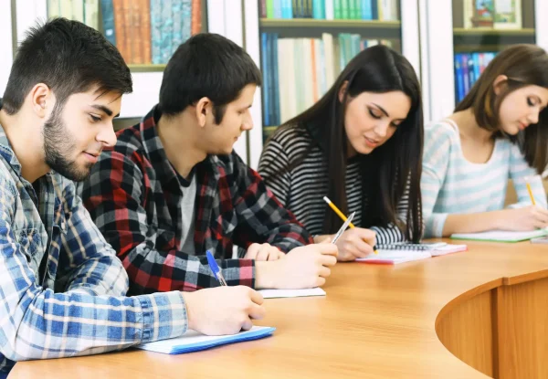 group-students-sitting-table-library (1)