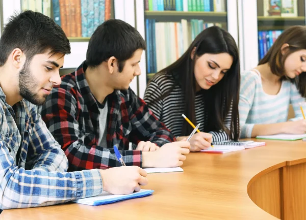 group-students-sitting-table-library (1)